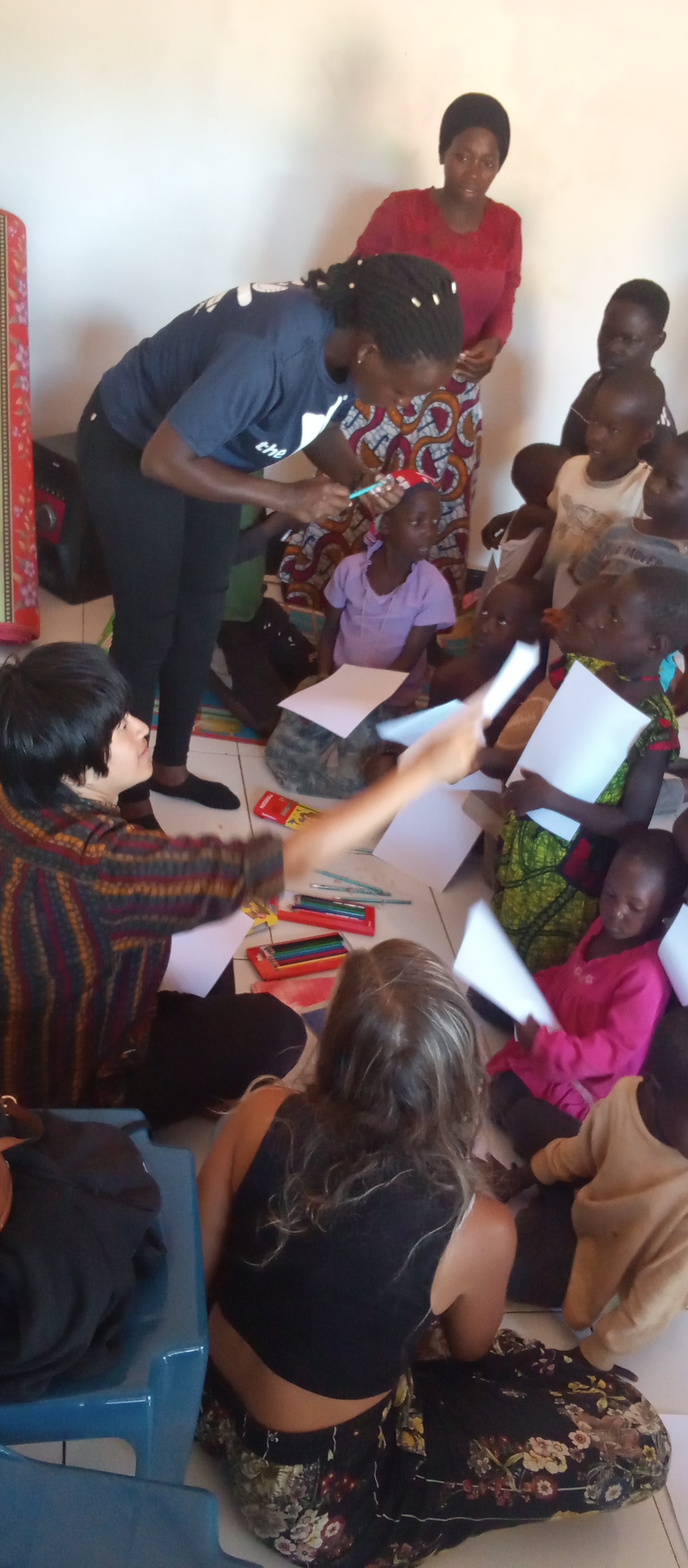 Volunteers helping children